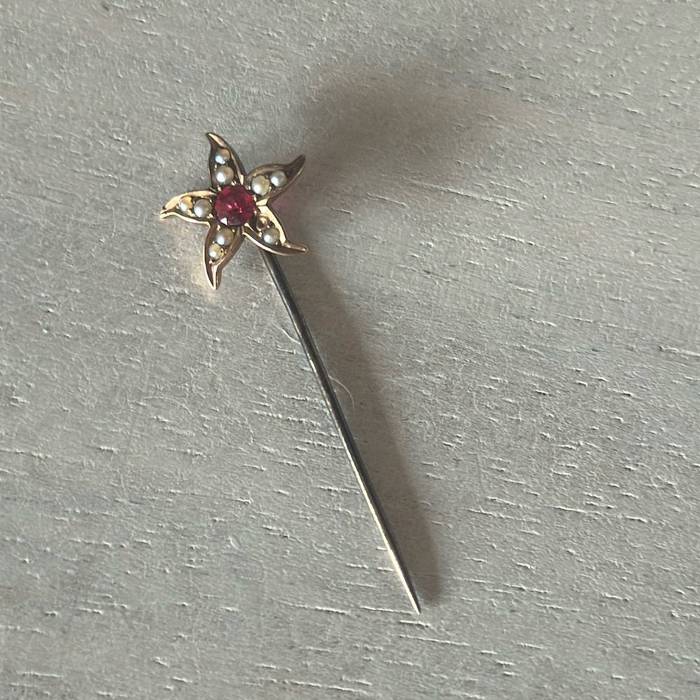 Antique stickpin. No stamp and not sure about stones or metal.